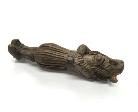 Treen: A wooden nut cracker modelled as a long haired Nordic figure with crossed arms (examine).