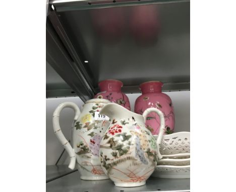 A pair of 19th century pink glass vases, enamel decorated with insects and flowers (one af) together with four pierced porcel