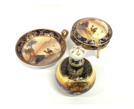 A Noritake single handle saucer dish decorated with an Arab on camel outside a tent in desert setting together with a matchin