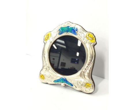 An Art Nouveau style silver and enamel photograph frame.