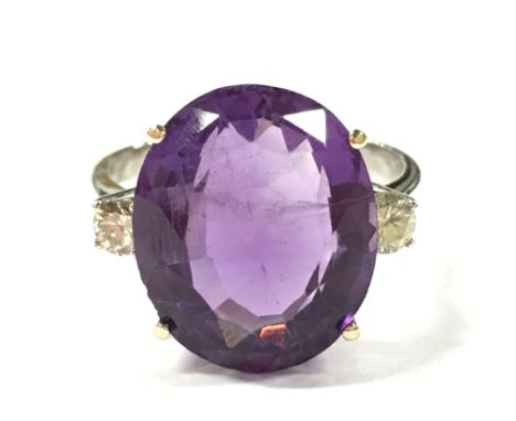 A large 18 carat white gold amethyst and diamond ring. Size T.
(R15)