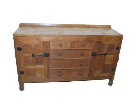 Oak Dining Room Suite from The Mouseman Robert Thompson. A Refectory table with facet carved supports, flat sectioned stretch