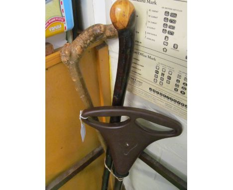 Two sticks and a shooting stick