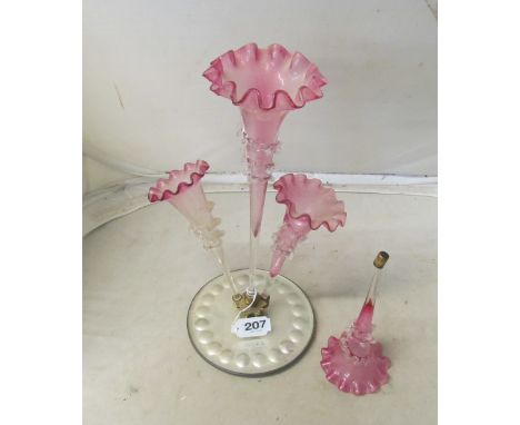 An epergne with pink glass flutes