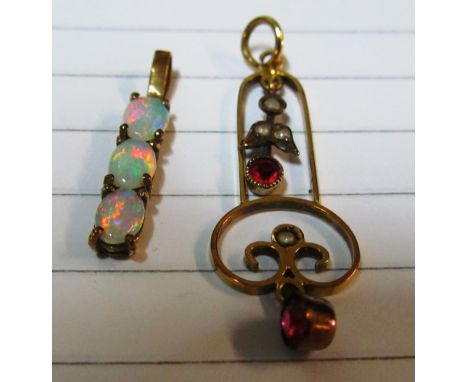 A 10ct gold and opal pendant and an Edwardian seed pearl and ruby pendant