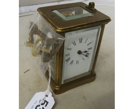 A brass carriage clock (handle a/f)