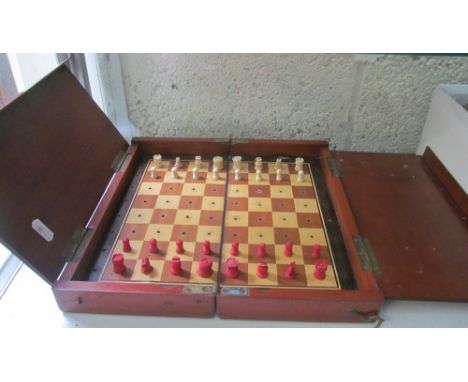A travelling Chess set with bone pieces