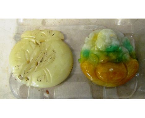 A jade fish pendant and Buddha pendant