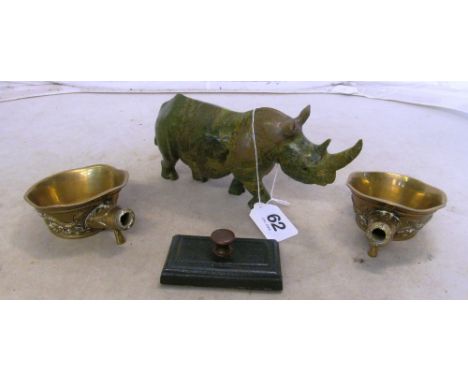 A jade effect rhinoceros and two brass ladles (no handles)