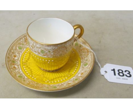 A Royal Worcester yellow cup and saucer