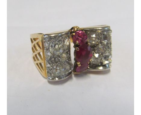 An 18ct gold Art Deco style diamond and ruby ring 8.4g18ct markone ruby more watery in colour to other 2seems to sparkle