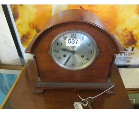 A mahogany mantel clock