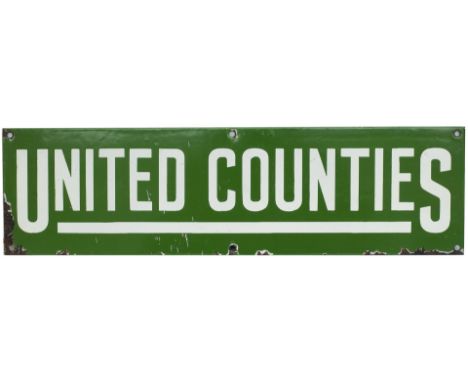 Motoring Bus enamel timetable heading UNITED COUNTIES. Measures 20in x 5.5in and is in good condition with some chipping.