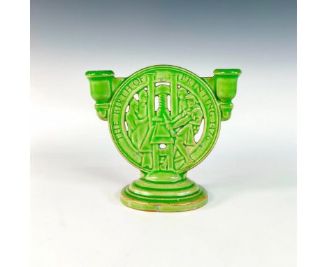 Green glazed candelabra with medallion shaped center; openwork details modeled as figures using a printing press.Produced for