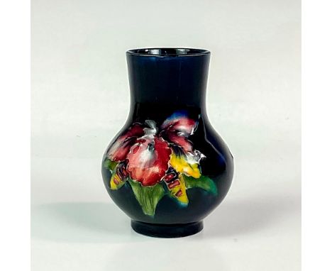 Bulbous form decorated with orchids and leafage in shades of pink, blue, purple, yellow, white, and green, on a blue-green gr