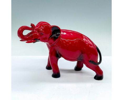 Style One. A red and black glazed porcelain figure of an elephant with the trunk up and towards the head. Royal Doulton backs