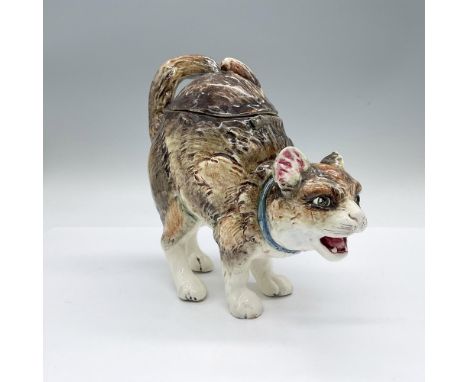 A ceramic, hand painted covered figural vessel of a standing hunched feline with a blue collar. Issued: C. 1880Dimensions: 8.