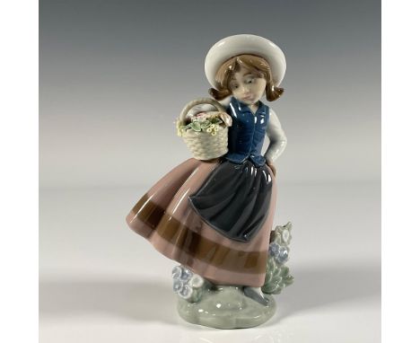 Glossy finish; young girl holding a basket of flowers. Lladro backstamp. This item has its original box. Box measures: 4.75"L