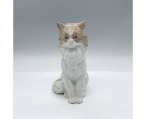 A seated figure of a long hair feline. White, brown and gray coloration. Nao by Lladro backstamp. Artist: Jose RoigIssued: 20