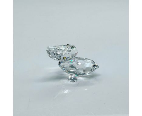 Clear faceted figure of a water bird with blue-green eyes. Part of the Feathered Friends collection. Swarovski etched mark. T