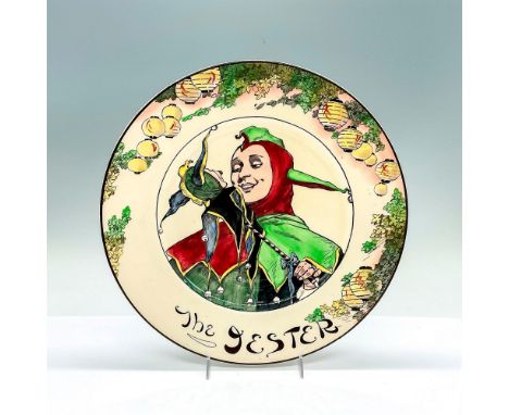 Part of the Professionals series. A round rack plate featuring a Jester with a puppet. Brown trim. Royal Doulton backstamp. I