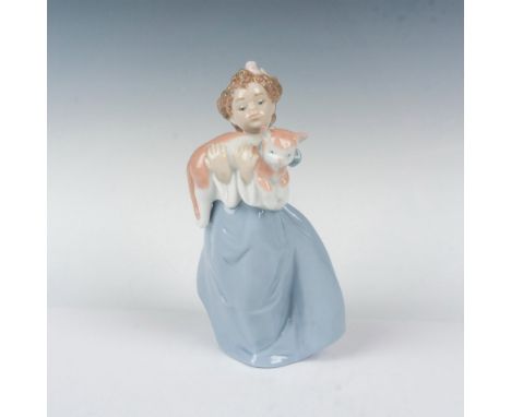 Glossy finish; young girl holds her charming kitty with blue bow around his neck. Lladro backstamp. This item has its origina