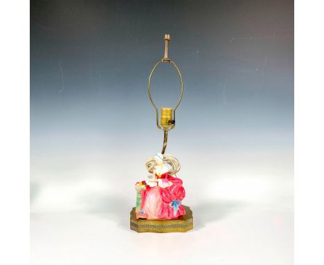 A gilded ornate lamp featuring the figurine Penelope HN1401, hand painted in red, green, white, and blue coloration. Dimensio