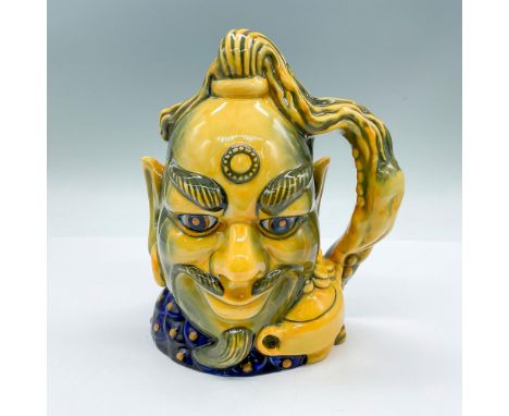 Aladdins Genie D6971; yellow and blue glazed flambe figure of a genie. Hand formed as a lamp with a ghost form and tassel. Ro