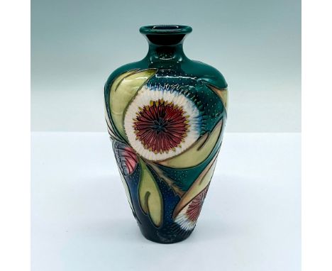 A small green glazed vase with a dandelion and acorn motif. Detailed tube lining. Moorcroft marking on the base. Artists' mar