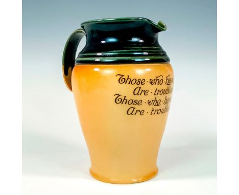 Juniper-green glaze over a salt-glazed pitcher printed with quoteÂ&nbsp;THOSE WHO HAVE MONEY ARE TROUBLED ABOUT IT, THOSE WHO