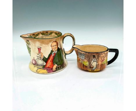 The larger pitcher features a gentleman sits, smiling and holding up his beverage in a glass, 6.25"L x 3.75"W x 4"H. The smal
