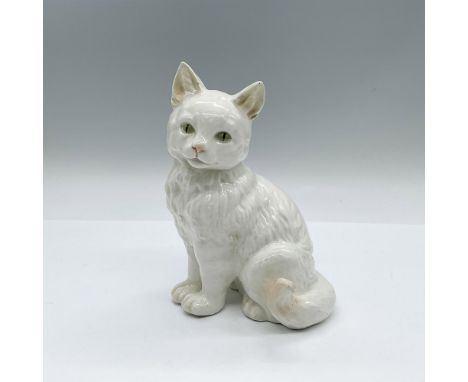 A glazed white seated cat with green eyes. Goebel backstamp. Issued: 1950-1955Dimensions: 4.75"L x 4.25"W x 6.5"HManufacturer