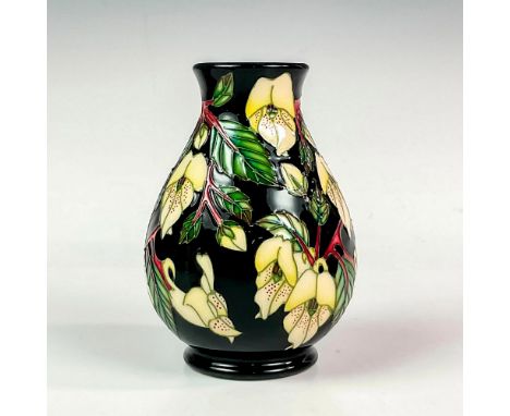 Stunning vessel of ovoid form decorated with tube line flowers and its foliage, set against a black ground; glaze interior. A