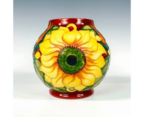 A very beautiful low vessel with tube-line decorations featuring large sunflowers set against a rust field. Moorcroft Made In