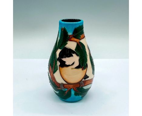 A small vase adorned in adorable chickadees perched on a pine tree branch. Detailed tube lining. Moorcroft and artist's marki