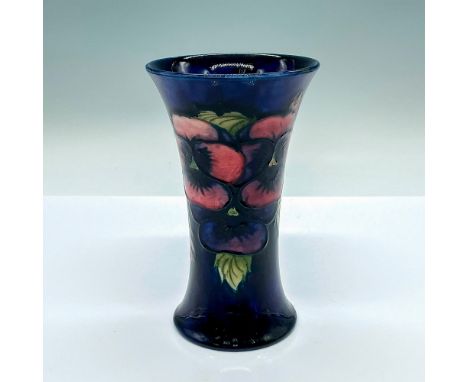 Dark cobalt blue glazed vase with purple and pink flowers. Moorcroft markings on the base. Potters to H. M. The Queen sticker