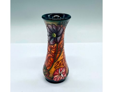 A small slender green and orange glazed vase with stunning floral tube lining. Moorcroft and artist's markings on the base. T