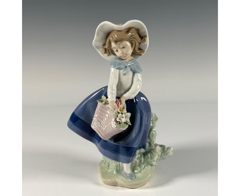 Glossy finish; a girl holds a basket of freshly picked flowers. Lladro backstamp. This item has its original box. Box measure