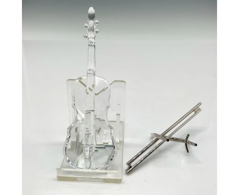 Clear beautifully detailed musical instrument and metal stand with bow attached. Swarovski backstamp. 7477 000 002. This item