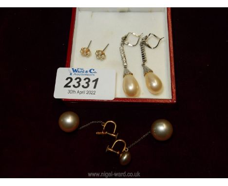 Three pairs of simulated pearl earrings including screw back and pierced sets.