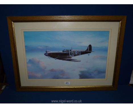 A framed and mounted Print of a Spitfire, no visible signature, 30'' x 21 1/2''.