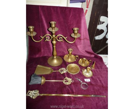 A small quantity of brass including a candlestick, chamber-sticks, fire irons, etc.