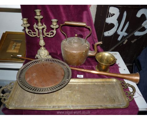 A copper kettle, brass and copper hunting horn, pestle and mortar, candlestick etc.