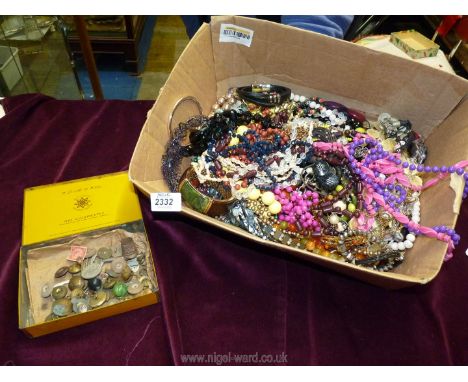 A box of costume jewellery and a tin of brass buttons including Australian Military Forces uniform button, etc.