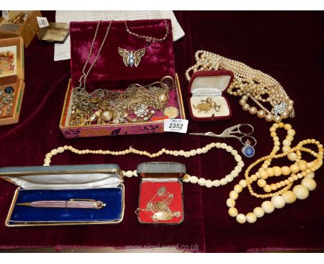 A quantity of jewellery including a seven strand simulated pearl necklace, brooches, chains, bone necklace, etc.