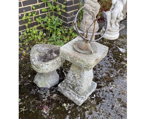 A sphere sundial on reconstituted stone plinth, height 85cm, and a smaller shell shaped bird bath