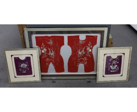 Three early 20th century Chinese framed embroideries: two purple baby’s bibs embroidered with multi-coloured silk threads, an