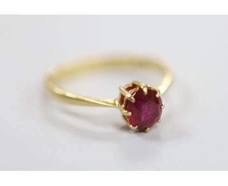 A 1960's 18ct gold and solitaire ruby set ring, size O, gross weight 2.2 grams.