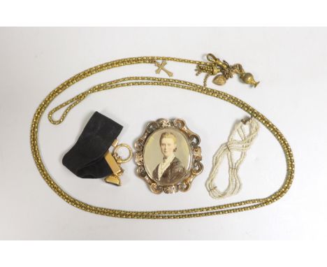 A 19th century yellow metal overlaid and bloodstone set fob seal, 22mm, on a yellow metal mounted black sash, a similar gilt 