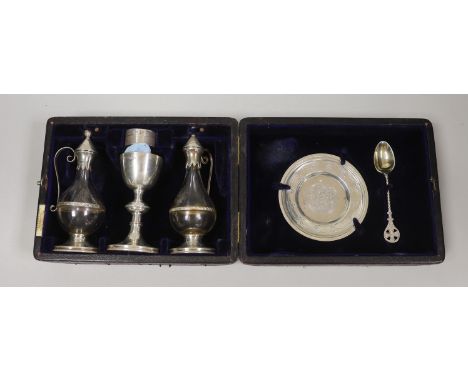 A cased late Victorian four piece silver communion set, Henry Wilkinson &amp; Co Ltd, Sheffield, 1894, together with a matche